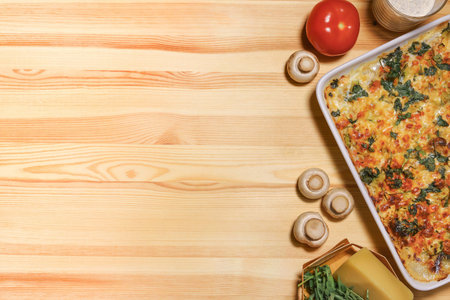 Chicken vegetable cheese pie on the light wooden backgroundの写真素材