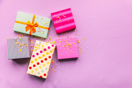 Holidays giftboxes on the pastel pink backgroundの写真素材