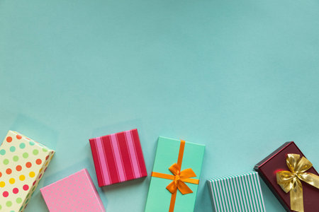 Holidays giftboxes on the pastel mint background for mother's day, christmas, birthday