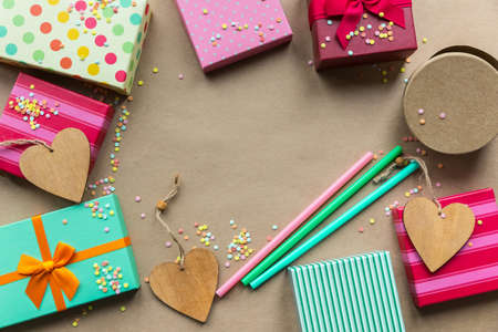 Holidays giftboxes on the craft paper background for a mother's day, christmas, birthdayの写真素材