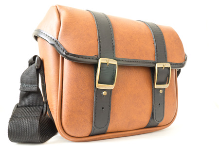 The brown leather messenger bag on white の写真素材