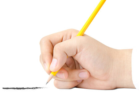 The side view of hand is holding the yellow wood pencil and writing the straight line on white background.の写真素材
