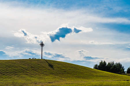 Beautiful Countryside Landscape. Sunny Afternoon. Wonderful Landscape, Grassy Field and Hill With Symbol on the Topの写真素材