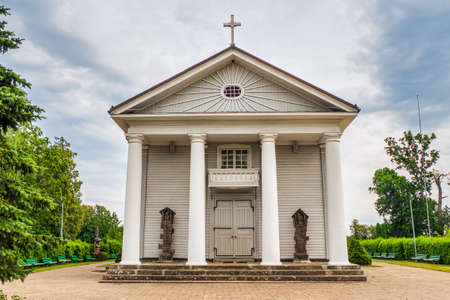 Old Wooden Church at Sunset Clouds. The Church of the Assumption of the Blessed Virgin Maryの写真素材