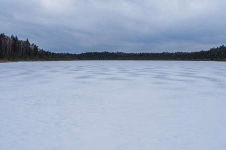 Winter Forest Landscape on the Frozen Lakeの写真素材