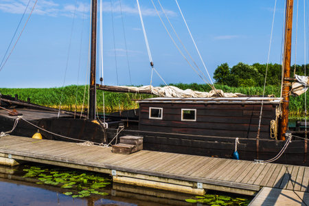 Old Traditional Wooden Sailing Ship in the Harbor