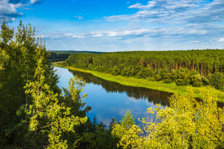 Beautiful Summer Landscape with River and Forest Under Blue Skyの写真素材