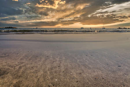 stunning sunrise at the beach in Mediterranean Alicante of Spainの写真素材