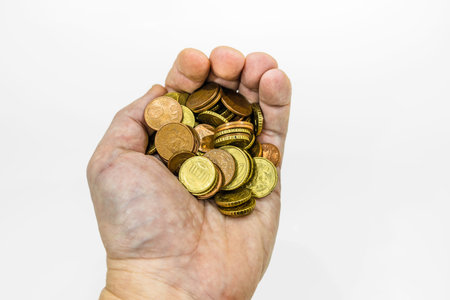 hand holding euro coins on white background