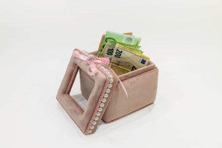 euro money banknotes in the open jewelry or gift box with a ribbonの写真素材