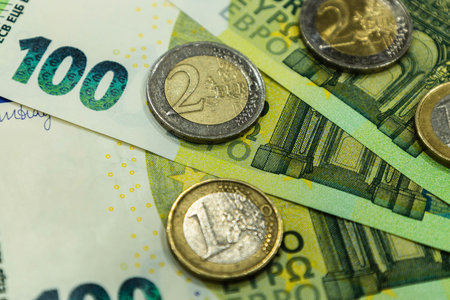 100 euro banknote and coins, euro finance currency close up detail