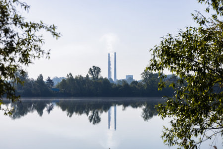 Power refinery plant with chimney striped pipes.