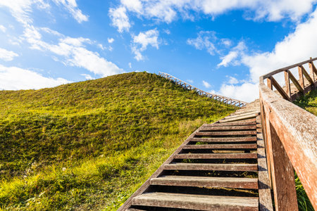 Wooden stairs going up to the historical mound of Seredzius, Lithuania.の写真素材