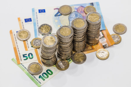 Euro notes and stacked coins. Finance banking money concept and saving energy.の写真素材