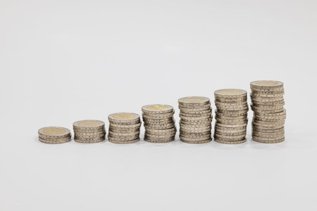 Stack of ascending coins. Financial accounting, saving money, and energy concept.