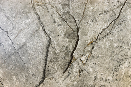 Stone rust texture or background with corrosion spots and deep crack.の写真素材