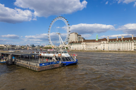 London Eye and River Thames: A Scenic View in the UK Capitalの写真素材