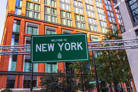 Welcome to New York - Road Sign with Modern Urban Backgroundの写真素材