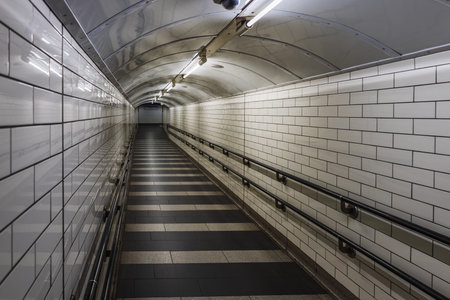 Empty Tunnel in the London Underground with White Tiles and Fluorescent Lights
