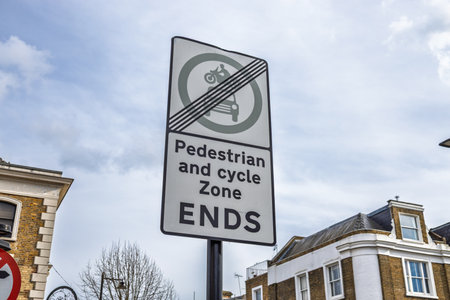 Pedestrian and bicycle path ends sign in urban areaの写真素材