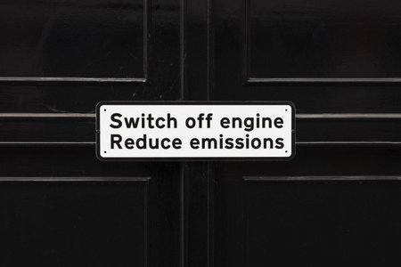 Switch Off Engine Sign on Dark Gate, Environmental Reminder to Reduce Emissions and Pollution