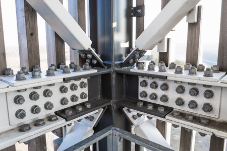 High strength bolted steel beam intersection in modern industrial architectural frame