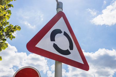 Roundabout Warning Road Sign. Traffic Safety and Navigationの写真素材