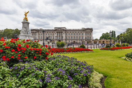 Buckingham Palace and Victoria Memorial with Vibrant Gardens, London, United Kingdomの写真素材