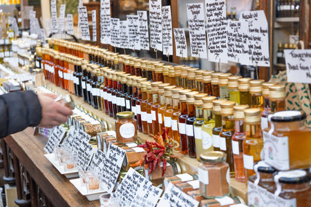Customer Shopping for Organic Honey and Preserves at Farmers Market. London, UK, 17 December 2023のeditorial素材