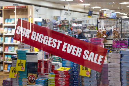 Red Sale Sign on Retail Store Window Display. London, UK, 31 December 2023のeditorial素材