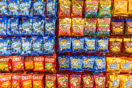 Variety of colorful snack bags displayed on a store shelf. London, UK, 2 June 2024のeditorial素材