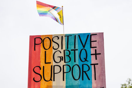 Positive LGBTQ support sign with progress pride flagの写真素材
