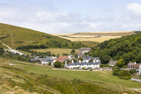 Panoramic view of Lulworth Cove village and rolling hills. Wareham, UK, 3 July 2024のeditorial素材
