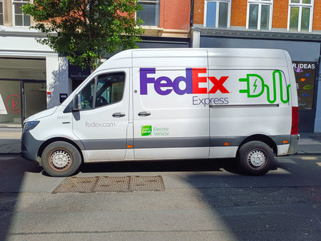 FedEx Electric Delivery Van parked on urban street. London, UK, 8 May 2024