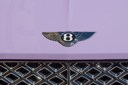 Bentley luxury car emblem on a lavender hood. Vilnius, Lithuania, 2 July 2025