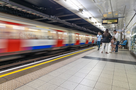 London underground train platform with commuters. London, UK, 21 May 2023