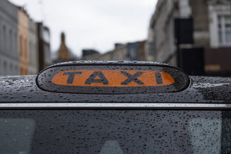 Close up of a classic black taxi cab roof sign. London, UK, 1 April 2024