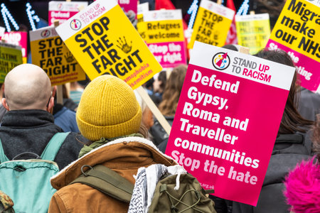 Crowd demonstrating against far right politics in public street. London, UK, 16 March 2024