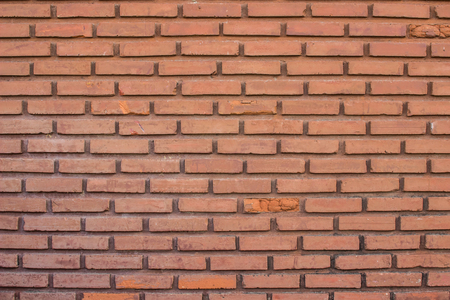 Weathered stained old brick wall background and textureの写真素材