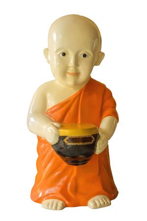 little monk statue on whiteの写真素材