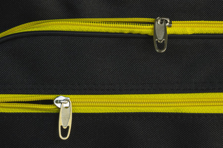 Zip yellow on black cloth.の写真素材