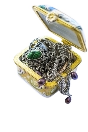 Little enamelled chinese box with jewelry over whiteの写真素材
