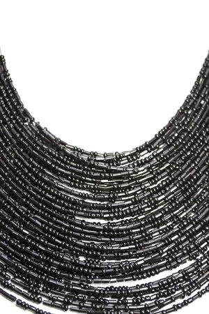 Black beaded necklace on white backgroundの写真素材