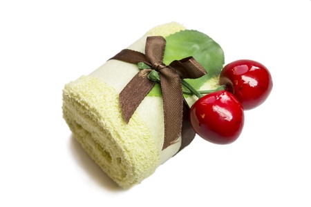 Decorated rolled terry towel isolated on white backgroundの写真素材