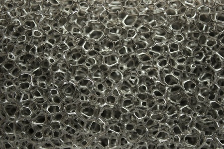 Monochrome plastic sponge texture closeupの写真素材