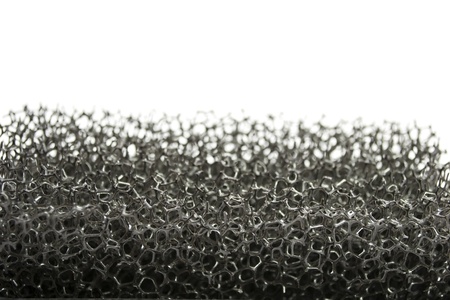 Monochrome plastic sponge closeup on white backgroundの写真素材