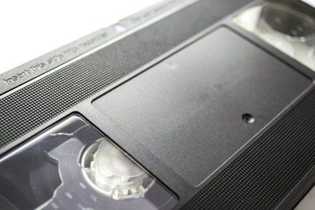 Videocassette on white background closeup