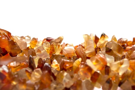 Orange glossy gemstones over whiteの写真素材
