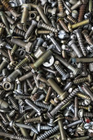 A lot of different screws backgroundの写真素材