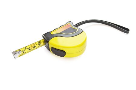 Yellow tape measure isolated over whiteの写真素材